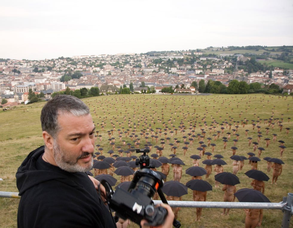 Camera, Video camera, Beard, Cameras & optics, Camera operator, Residential area, Videographer, Facial hair, Suburb, Camera accessory, 