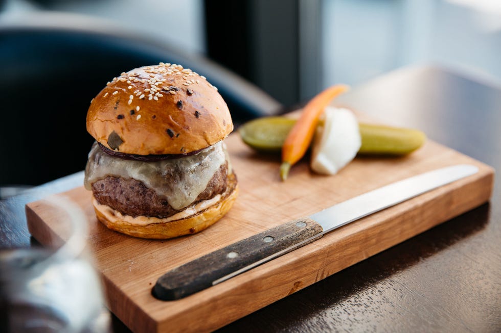 <p>This sometimes-on-sometimes-off menu burger is the best kept secret on the NoMad hotel's American tavern meets English pub eatery, and is topped with white cheddar, a special house sauce, and pickled red onion. The decadent flavors pair perfectly with the strong drinks and savory appetizers. Note: they may not ask you how you'd like your burger cooked here...because they shouldn't have to in order to nail the perfect temp. However, do specify if you'd like it cooked to any temperature other than medium rare. Fun fact: Regardless of where you dig in, ordering your meat at any temperature past medium usually indicates to the chef that you won't taste the difference between high quality beef and a sub-par cut, and so less reputable spots will even go as far as to serve you something that's not up to snuff. If you're ordering a burger from a place on this list, odds are it'll most likely ruin the texture and flavor of how the patty is intended to taste.</p><p><em><a href="https://www.thenomadhotel.com/#!/dining/spaces/the-nomad-bar" target="_blank">The Nomad Bar, 10 West 28th Street</a></em><a href="https://www.thenomadhotel.com/#!/dining/spaces/the-nomad-bar"><em></em></a><span class="redactor-invisible-space"></span></p>