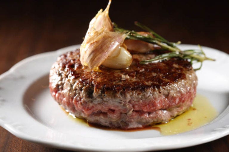 <p>No bun and tartare-level rare, this is the most unexpected burger in the city–and we cannot get enough of it. We know, we know–a bun and your choice of temperature feels sacrilege to live without, but  this tartare-meets-burger topped with fried herbs is to die for, packed with flavor and utterly addictive. Served in an unexpected environment–Via Carota serves rustic Italian and French skewed share plates–this is something you will likely be ordering a second round of after devouring it minutes after it hits the table.</p><p><em><a href="http://www.viacarota.com/#about" target="_blank">Via Carota, 51 Grove Street</a></em><em><a href="http://www.viacarota.com/#about"></a></em></p>