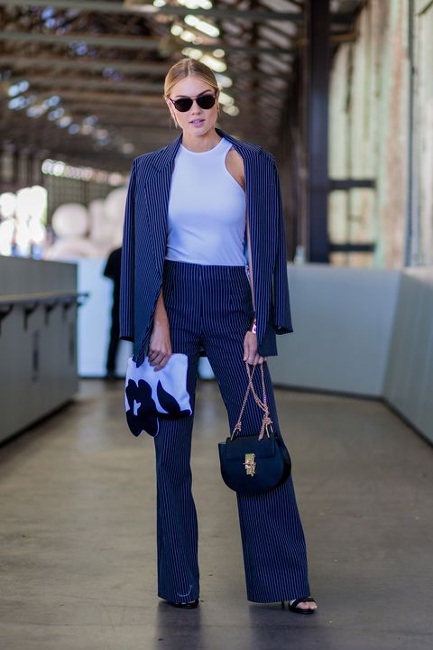 <p>Elyse Knowles' navy pantsuit could read workwear save for a fitted white tank to up the cool girl appeal. </p>