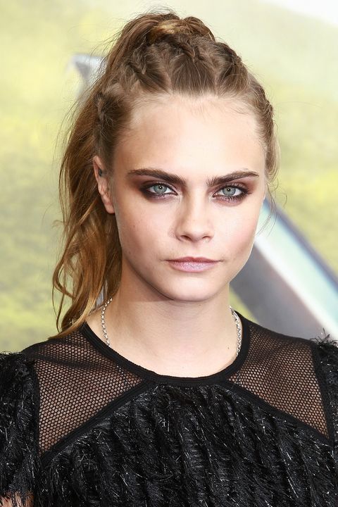 Up doesn't have to equal stodgy. Incorporate tightly woven braids or a metallic accessory to give a tail or twist an updated edge.<p><br></p><p><em>Cara Delevingne </em></p>