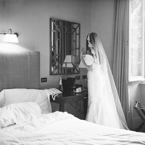 <p>The bride, friends and family stayed at the <a href="https://www.roccofortehotels.com/hotels-and-resorts/hotel-de-russie/?utm_source=google&utm_medium=local&utm_campaign=hotel_de_russie" target="_blank">Hotel de Russie</a> the week preceding the wedding, and got dressed there before all of the weekend's events. Here, Natasha puts the finishing touches on her <a href="http://moniquelhuillier.com" target="_blank">Monique Lhuillier</a> gown and veil. "The morning of the wedding did not go as I had planned, but nothing in life ever does—and I firmly believe that spontaneity is what makes it worth living," Natasha recalled. <span></span></p>