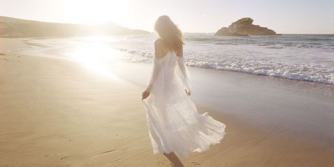 Clothing, Photograph, Dress, Coastal and oceanic landforms, Ocean, People on beach, Beach, Wedding dress, Sunlight, People in nature, 
