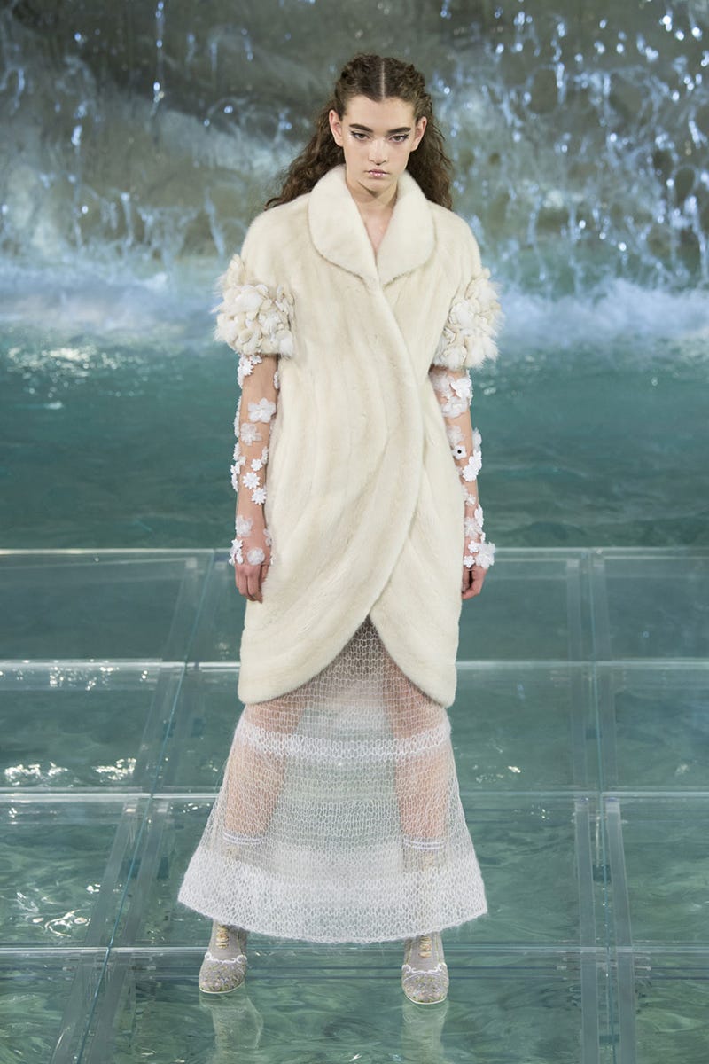 Sleeve, Textile, Photograph, Beauty, Street fashion, Aqua, Teal, Water feature, One-piece garment, Vintage clothing, 