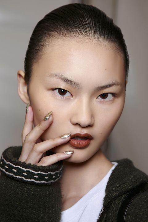<p>The gold and silver flecked nails at Kenzo will look hot with a bikini, and cool with a chunky sweater.</p>