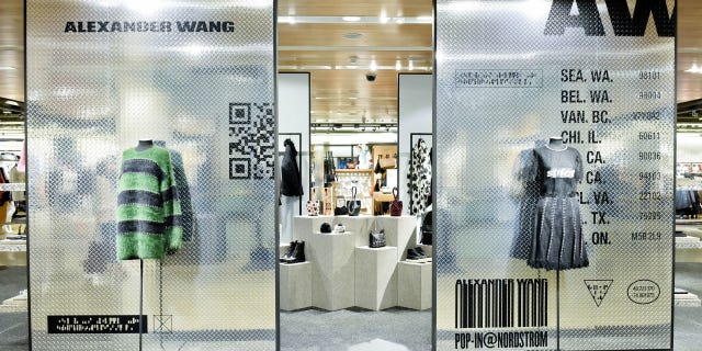 Pattern, Fashion, Dress, Retail, Grey, Advertising, Mannequin, Outlet store, Light fixture, Design, 
