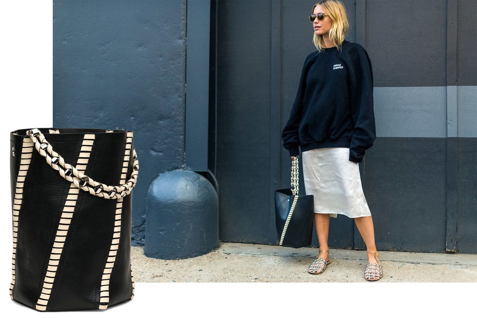 <p>Pernille Teisbaek<span class="redactor-invisible-space"> showed that the Proenza Schouler "Hex" bucket bag is the one to have and to hold.&nbsp;</span></p><p><span class="redactor-invisible-space"><em data-verified="redactor" data-redactor-tag="em">Proenza Schouler "Hex" bag, $1,960, <strong data-redactor-tag="strong" data-verified="redactor"><a href="https://shop.meltsflow.com/p/proenza-schouler/large-hex-whipstitch-bucket-in-blackecru-10197.html" target="_blank">shopBAZAAR.com</a></strong>.&nbsp;</em><br></span></p>
