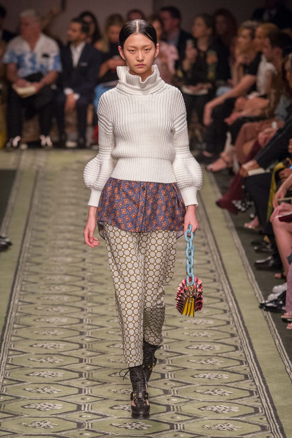 Clothing, Footwear, Leg, Human, Fashion show, Human body, Shoulder, Joint, Outerwear, Runway, 