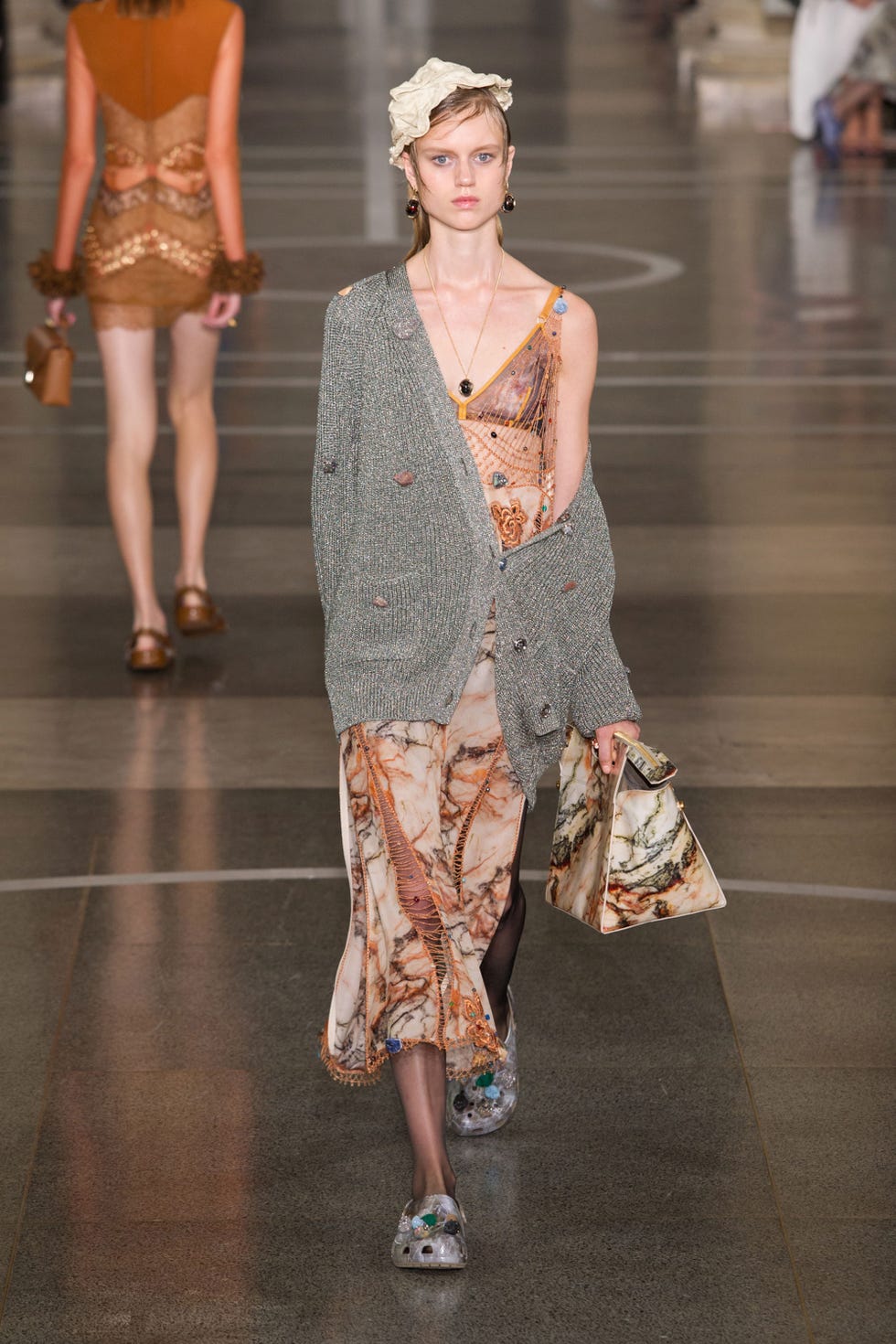 Clothing, Footwear, Brown, Fashion show, Shoulder, Human leg, Textile, Joint, Style, Runway, 