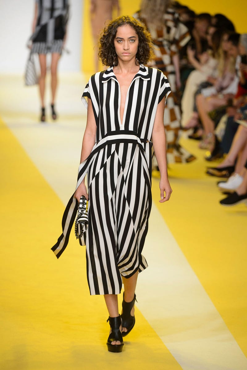 Clothing, Footwear, Human, Fashion show, Yellow, Shoulder, Runway, Dress, Joint, Outerwear, 