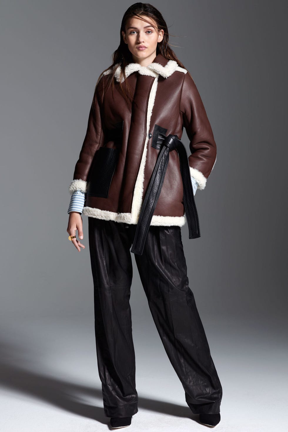 <p>Every woman needs a cozy-as-can-be shearling to dress up or down all season long. Strike the perfect high-low balance by wearing yours&nbsp;with wide leg leather trousers.<span class="redactor-invisible-space" data-verified="redactor" data-redactor-tag="span" data-redactor-class="redactor-invisible-space"></span></p><p><em data-redactor-tag="em" data-verified="redactor"><strong data-redactor-tag="strong" data-verified="redactor">Acne Studios</strong> 'Fayette' Oversize Genuine Shearling Coat, $3,300, <a href="http://shop.nordstrom.com/s/acne-studios-fayette-oversize-genuine-shearling-coat/4341100?&amp;cm_mmc=Mindshare_Nordstrom-_-WAP_October-_-Hearst-_-proactive" target="_blank">nordstrom.com</a>; <strong data-redactor-tag="strong" data-verified="redactor">IRO</strong> 'Mia' Stripe&nbsp;Cotton &amp; Modal Shirt, $179, <a href="http://shop.nordstrom.com/s/iro-mia-stripe-cotton-modal-shirt/4303486?&amp;cm_mmc=Mindshare_Nordstrom-_-WAP_October-_-Hearst-_-proactive" target="_blank">nordstrom.com</a>; <strong data-redactor-tag="strong" data-verified="redactor">IRO</strong>&nbsp;Bird Leather Trousers, $1,150, <a href="https://www.iroparis.com/us_en/bird-leather-pants.html" target="_blank">iroparis.com</a>; <strong data-redactor-tag="strong" data-verified="redactor">Vince</strong> 'Portia' Pointy Toe Pump, $375, <a href="http://shop.nordstrom.com/s/vince-portia-pointy-toe-pump-women/4421550?&amp;cm_mmc=Mindshare_Nordstrom-_-WAP_October-_-Hearst-_-proactive" target="_blank">nordstrom.com</a>; <strong data-redactor-tag="strong" data-verified="redactor">Paula Mendoza</strong> ring, for similar styles visit </em><a href="https://www.paulamendoza.com/eshop/" target="_blank"><em data-redactor-tag="em" data-verified="redactor">paulamendoza.com</em></a></p>