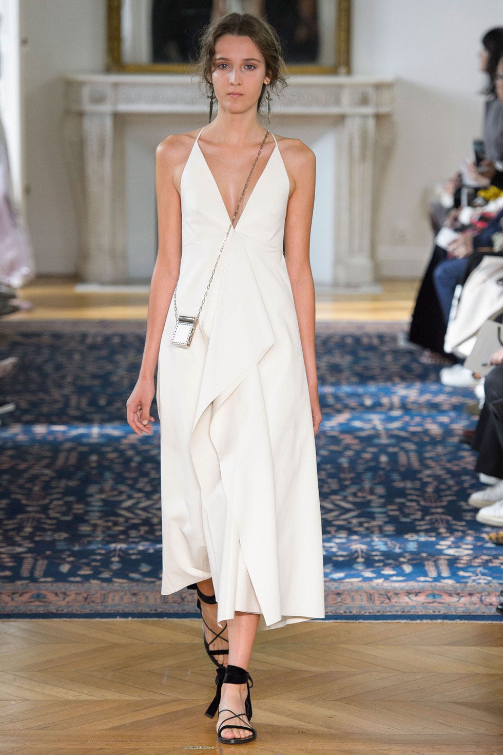 Shoulder, Joint, Dress, Human leg, Style, Fashion model, Formal wear, Fashion show, Floor, Street fashion, 