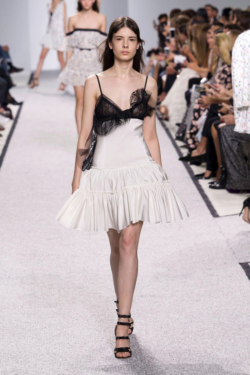 Clothing, Fashion show, Skin, Shoulder, Runway, Dress, Joint, Human leg, Fashion model, Waist, 