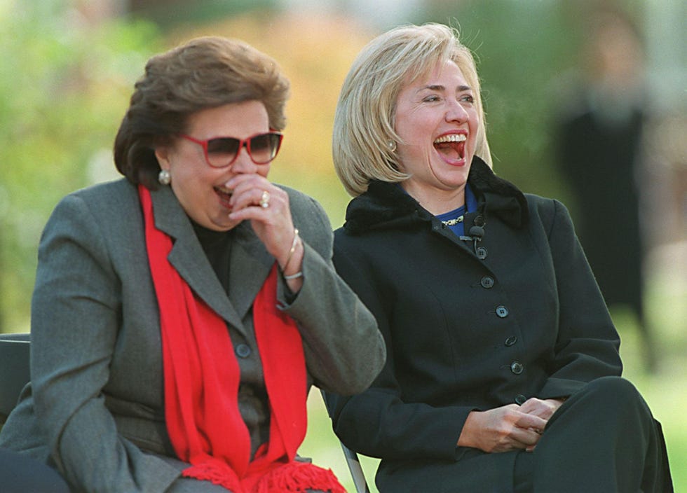 Outerwear, Coat, Sunglasses, Blazer, Jewellery, Blond, Conversation, Necklace, Laugh, Brown hair, 