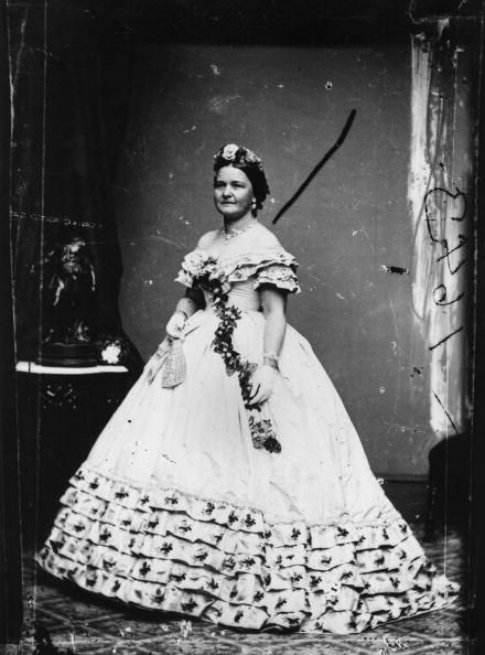 <p>A floral headpiece and sash picks up the embroidered floral accents in the dress Mary Todd Lincoln wore for her husband's inauguration. She famously loved to shop, racking up thousands of dollars in bills for clothes and decorations for the White House (which <a href="http://www.mrlincolnandnewyork.org/mr-lincolns-visits/mrs-lincolns-shopping/" target="_blank" data-tracking-id="recirc-text-link">reportedly enraged</a> the more practical President Lincoln).&nbsp;</p>