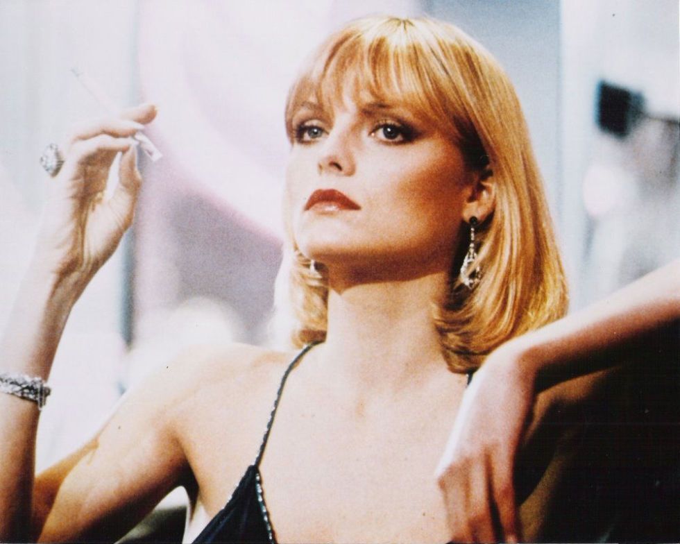 <p>The ultimate bad-girl style and beauty icon: Michelle Pfeiffer as Elvira Hancock in the 1983 film <em data-redactor-tag="em" data-verified="redactor">Scarface</em>. Her haircut is iconic:&nbsp;a sleek bob with bangs and flipped ends.</p>