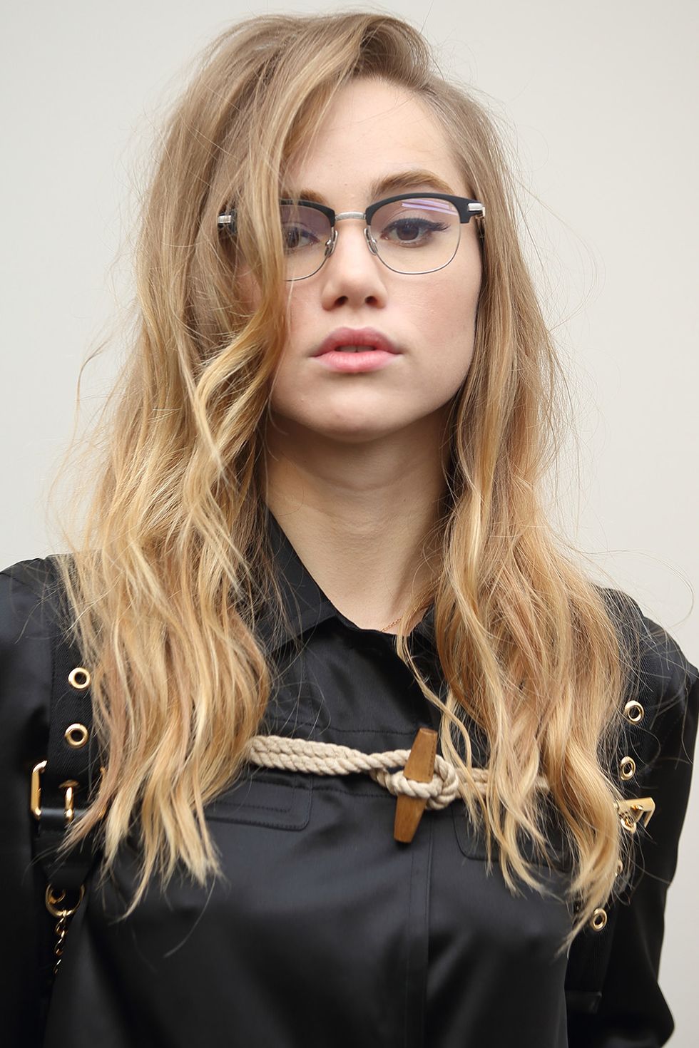 <p>Suki Waterhouse can pull-off messy waves anytime, anywhere. Here, she elevates them to something so much cheekier with vintage horn-rimmed glasses.</p>