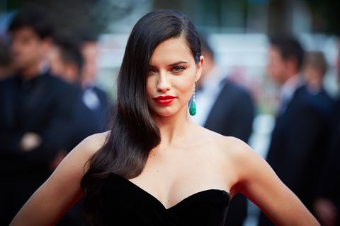 <p>Adriana Lima takes a page from Angelina Jolie (or did Jolie take a page from her?) with  patent-red lipstick and effortlessly glam waves.</p>