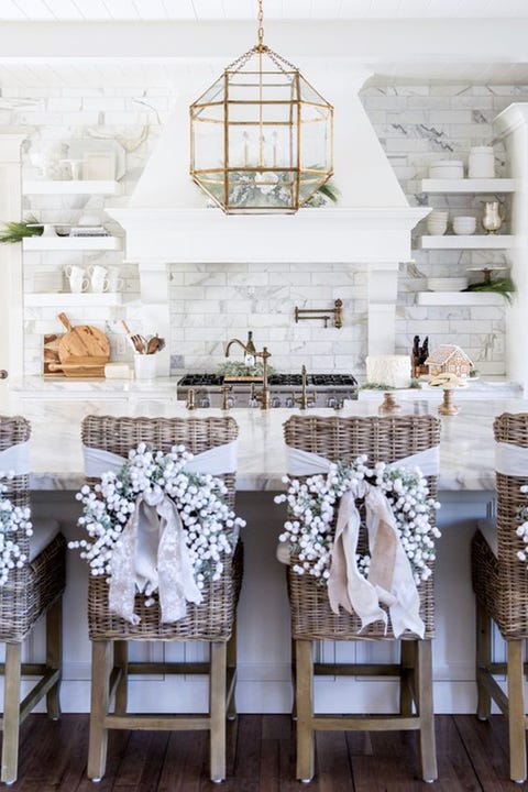 With a Wreath <p>Give your kitchen or dining room chairs a dose of holiday cheer with individual wreaths in winter white. </p> <p><em data-redactor-tag="em"><a href="http://pinkpeonies.com/our-home-for-christmas/" target="_blank" data-tracking-id="recirc-text-link">Via Pink Peonies</a></em></p>