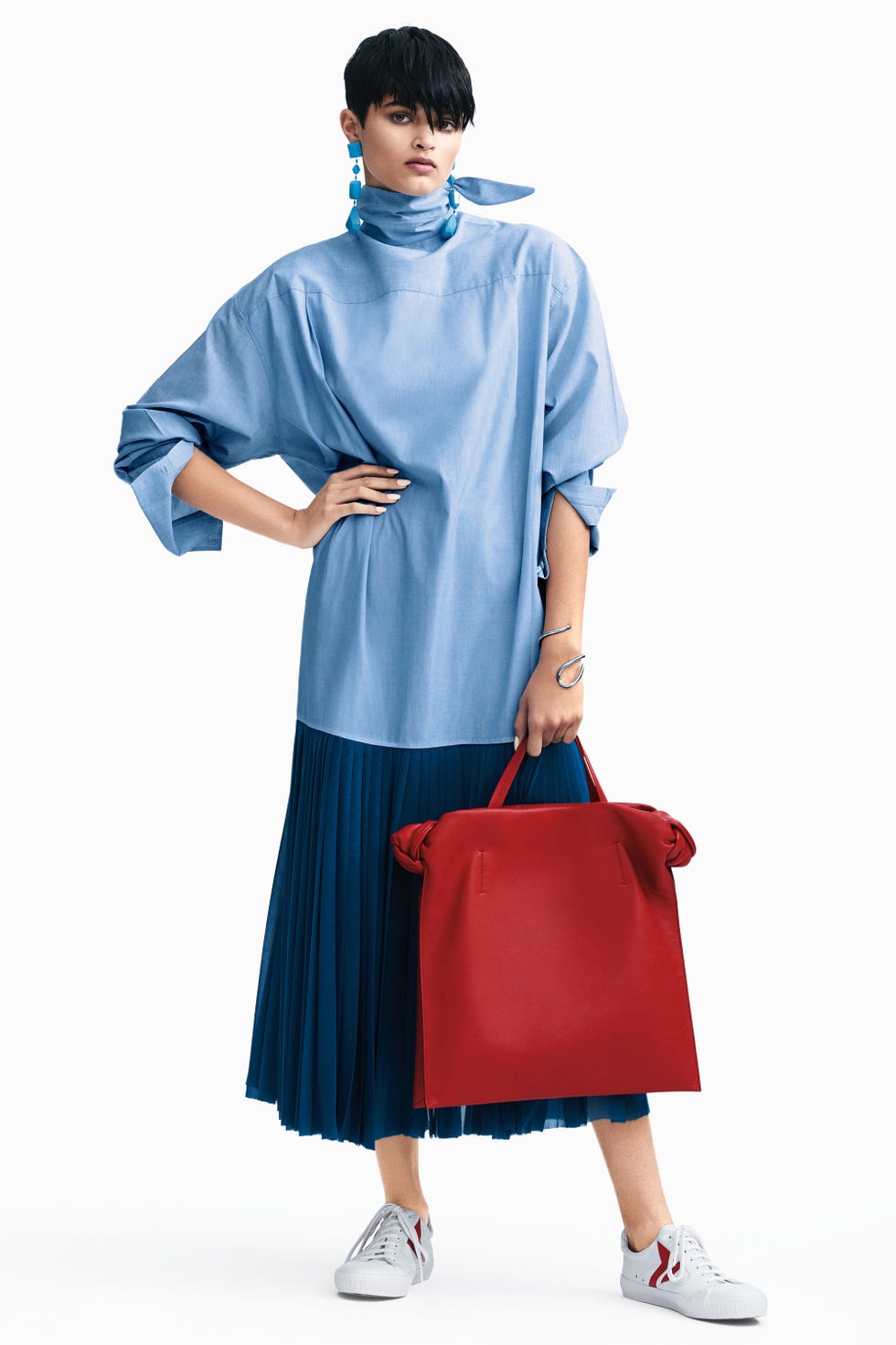 <p>Allow a voluminous top and a pop of red to take you to new heights.&nbsp;</p><p><span><strong data-redactor-tag="strong" data-verified="redactor">Céline</strong><span class="redactor-invisible-space"><strong data-redactor-tag="strong" data-verified="redactor"> </strong>d</span>ress, $2,350, earrings, $710,&nbsp;bag, $3,400,&nbsp;and sneakers, $590, 212-535-3703; <strong data-redactor-tag="strong" data-verified="redactor">Jennifer Fisher</strong> cuff, $685, <a href="https://jenniferfisherjewelry.com/" target="_blank" data-tracking-id="recirc-text-link">jenniferfisherjewelry.com</a>.&nbsp;</span><span class="redactor-invisible-space"></span></p>