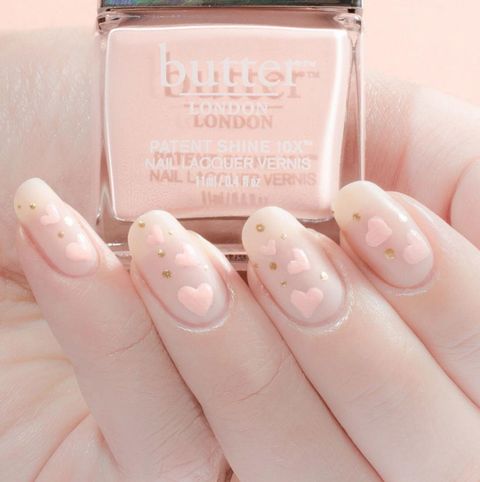 <p>The solution to simple nail art: pale pink hearts and gold dots painted directly onto the basecoat. <span class="redactor-invisible-space" data-verified="redactor" data-redactor-tag="span" data-redactor-class="redactor-invisible-space"></span></p><p><span class="redactor-invisible-space" data-verified="redactor" data-redactor-tag="span" data-redactor-class="redactor-invisible-space"><a href="https://www.instagram.com/p/BAtvPFpSBJa/"></a><em data-redactor-tag="em" data-verified="redactor"><a href="https://www.instagram.com/p/BAtvPFpSBJa/" target="_blank" data-tracking-id="recirc-text-link">@cassmariebeauty</a></em></span></p>