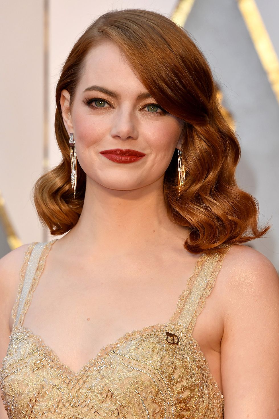 Emma Stone Goes Glam in Gold Givenchy at the Oscars -- See Her Dazzling Red  Carpet Look!