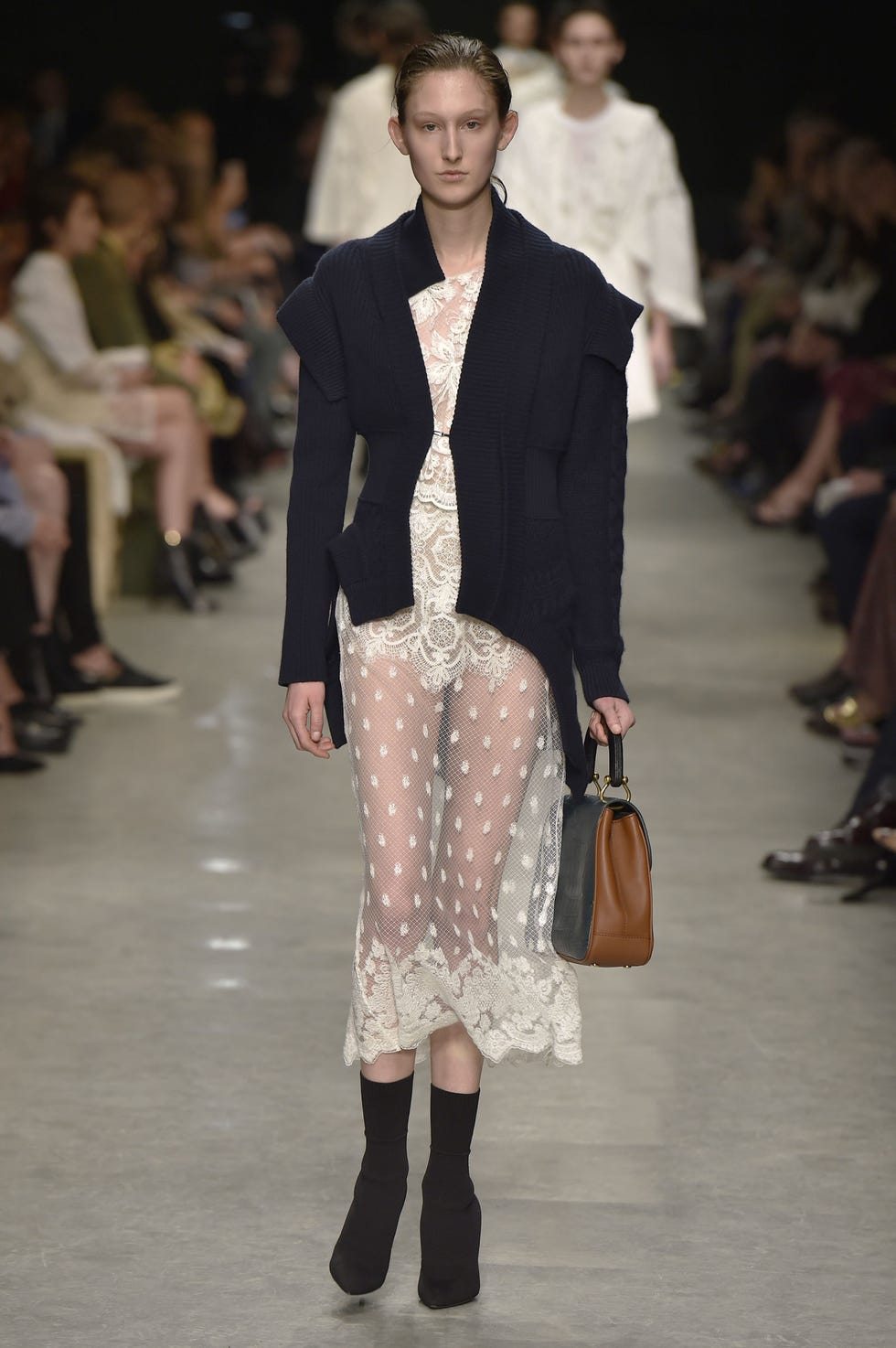 Clothing, Footwear, Leg, Brown, Event, Fashion show, Shoulder, Textile, Joint, Outerwear, 