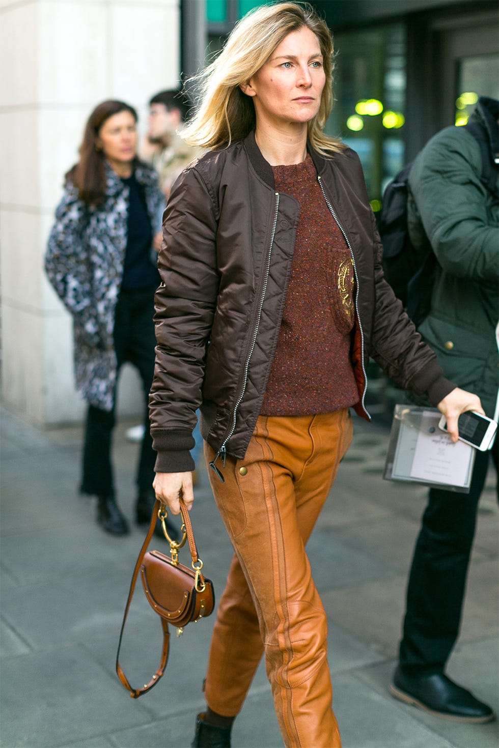 Footwear, Brown, Trousers, Human body, Jacket, Bag, Textile, Coat, Outerwear, Style, 