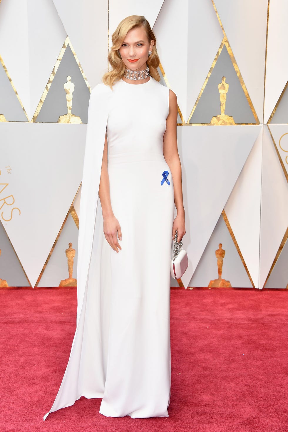 Red carpet, Clothing, Dress, Carpet, Gown, Flooring, Fashion, Neck, Fashion model, A-line, 