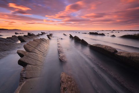 Sakoneta <p>This <a href="http://www.spain.info/en_US/que-quieres/destinos-playa/playas/guipuzcoa/sakoneta.html" target="_blank">clothing-optional beach</a> in northern Spain is essentially an expanse of rock formations. The rough swimming conditions can involve wind and powerful waves — but it's worth visiting to catch a beautiful sunset. </p>