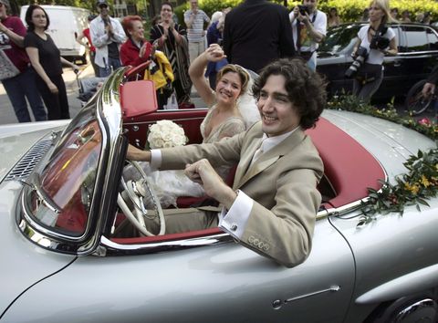 MONTREAL, QC - MAY 28: Justin Trudeau and bride Sophie Gregoire leave the Sainte-Madeleine D'Outremont Church, Montreal, after their wedding ceremony here, May 28, 2005. The car a 1959 Mercedez 300SL, was Pierre Trudeua's car and was recently renovated and given its original silver grey colour.        (Bernard Weil/Toronto Star via Getty Images)