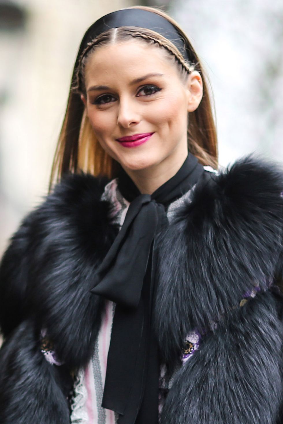 <p>Olivia Palermo took some of the sweetness out of her black headband by pairing it with two French braids woven along her hairline.</p>