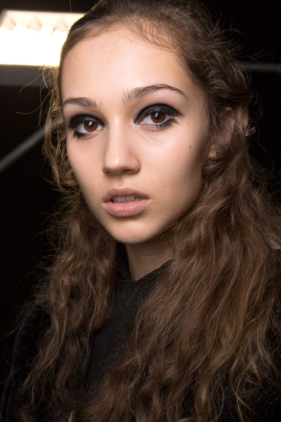 <p>The heavy-handed black liner approach seen at Versace also popped up at Marni, but this time it was continued to the lower lashes, too.&nbsp;</p>