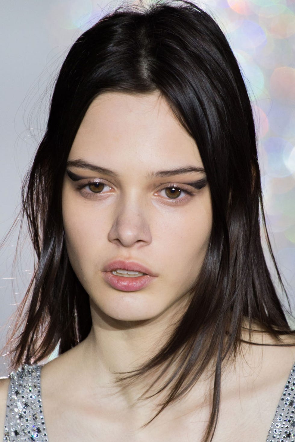 Yves Saint Laurent <p>In his years as a backstage makeup artist,Tom Pecheux has done and seen it all. But the YSL show this season called on him to do something he has never done before: As each model lined up for the finale, he decided to change their entire beauty look, going from a bare face to one with a wing of messy black pigment. Pecheux and his assistants dipped their fingers in The Shock mascara from YSL and swiped it across each models' lids one by one. Then they hit the runway one last time. It wasn't perfect by any means, but that was precisely the point. "For me, that is the YSL girl, and that girl is like 'Fuck it! Boom, boom! And I'm ready!' because everyone is always in such a rush," says Pecheux. " It was really right for the clothes, but it was really right for what was needed."<span class="redactor-invisible-space"></span></p>
