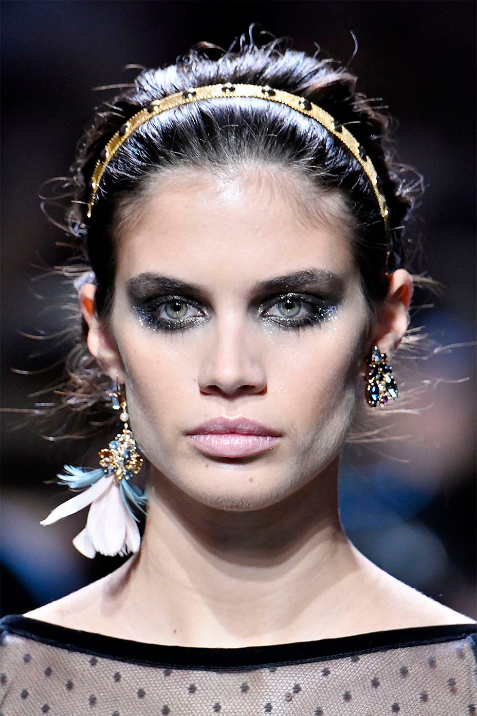 Elie Saab <p><strong data-redactor-tag="strong"> </strong>If we were rating looks from a little to a lot—black smoky eyes with a layer of glitter would be considered a lot of look. But something about the way Tom Pecheux expertly blended the liner and shadow around the eyes, then tapped on two different micro glitter pigments in silver and gold, made the eyes at Elie Saab seem delicate, feminine, and even soft. These were not disco eyes, or clubbing eyes—they were eyes fit for a spookier side of classic romance (the collection was inspired by <em data-redactor-tag="em">Giselle</em>, after all).<span class="redactor-invisible-space"></span></p>