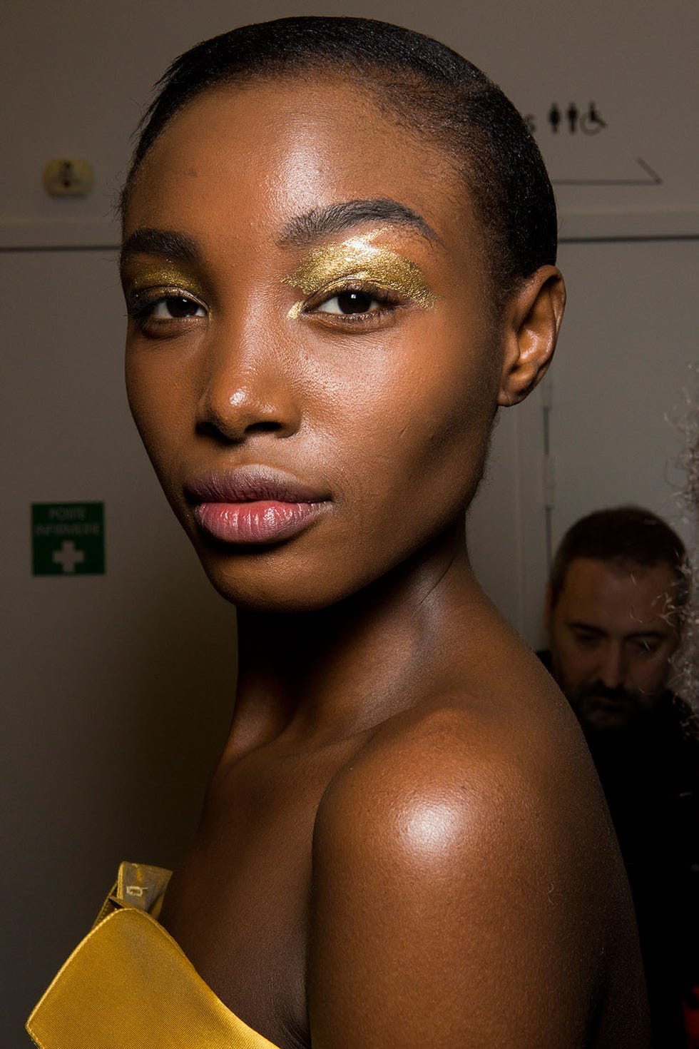 Alexis Mabille <p>This season is all about touches of metallics: a little silver swept under the eye, a little copper pressed on the center of the lid. At Alexis Mabille, gold was the element du jour, and it carried all the way down on the runway from the eyes to the foiled gold boots. Makeup artist Lloyd Simmons painted a gold pigment across the models' eyelids in a brushstroke pattern. The rest of the face we left bare. The eyes were only matched in shine-factor by the gold chrome nails.</p>