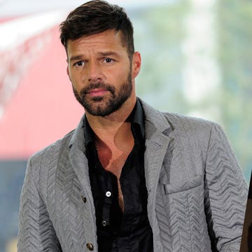 Cheek, Chin, Forehead, Eyebrow, Collar, Dress shirt, Outerwear, Coat, Facial hair, Jaw, 