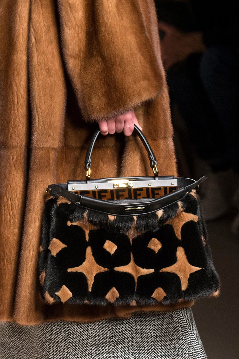 Handbag, Bag, Fashion, Fashion accessory, Brown, Material property, Shoulder bag, Hand, Coin purse, Fur, 