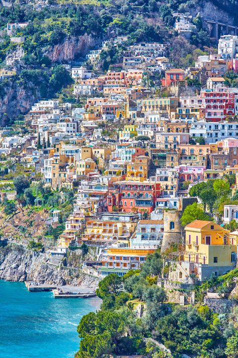 <p>Along the cliffside of this southern Italian town is a pebble beachfront and steep waterfront filled with some of the brightest and most colorful buildings ever. Not to mention there are plenty of white beaches and sea caves to explore while you're there.</p>