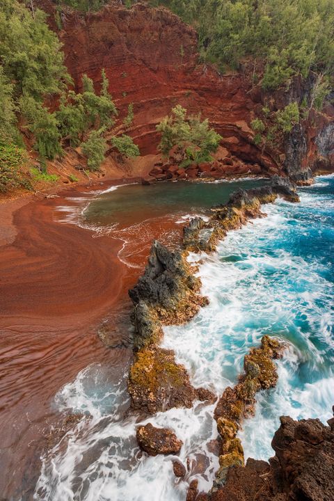 <p>The Kaihalulu Red Sand Beach is the result of the rocks and sand at this shore being high in iron content. When mixed with salty air and sea mist, this leads to a rusty red beach.</p>