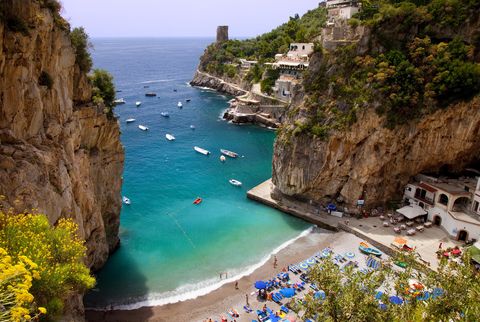<p>Marini di Praia is a pebble beach located at the foot of a cliff on the Amalfi Coast<span class="redactor-invisible-space" data-verified="redactor" data-redactor-tag="span" data-redactor-class="redactor-invisible-space"></span> and home to several restaurants and even one of the <a href="http://www.positano.com/en/e/beaches-of-praiano" target="_blank" data-tracking-id="recirc-text-link">most fashionable dance clubs</a> in the world. But it's the bright blue umbrellas and water that earns it a spot on this list.</p>