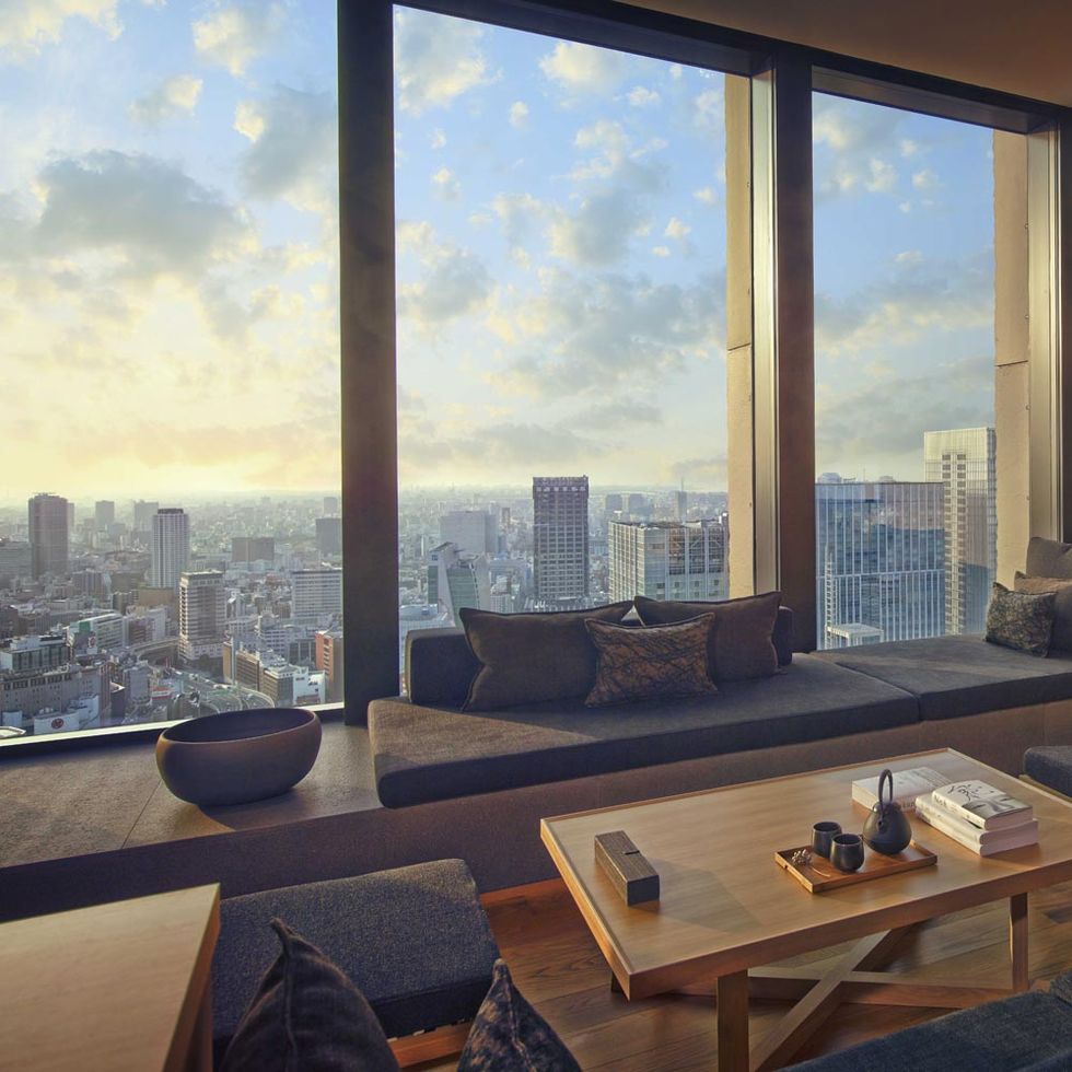 Room, Table, Interior design, Glass, Furniture, Apartment, Tower block, Floor, Coffee table, Wall, 