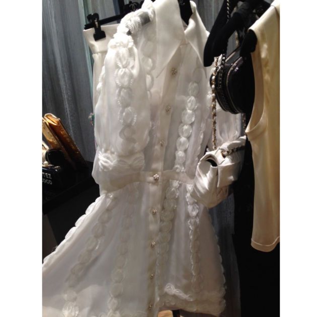 Sleeve, Dress, Textile, Bridal clothing, White, Formal wear, Gown, Wedding dress, Camera, Embellishment, 