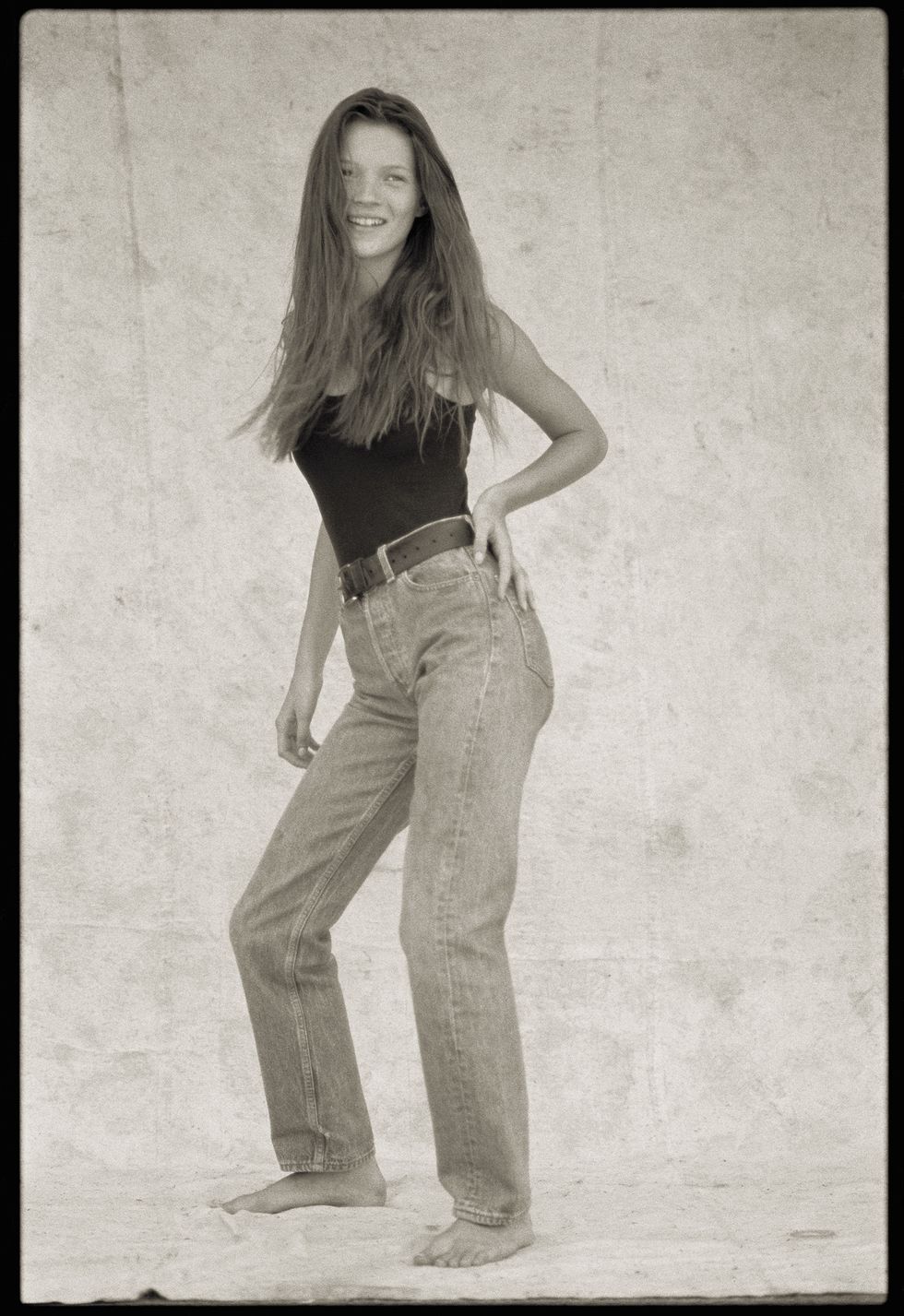 Photograph, Jeans, Standing, Denim, Beauty, Waist, Snapshot, Leg, Black-and-white, Long hair, 