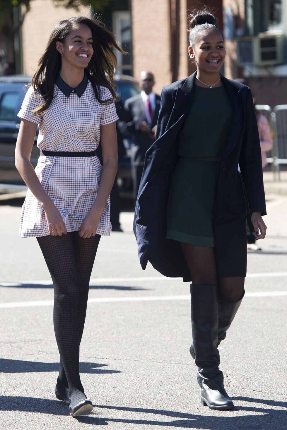 Malia and Sasha Obama attend an event marking the 50th Anniversary of the Selma to Montgomery civil rights marches at the Edmund Pettus Bridge in Selma, Alabama, on March 7, 2015. US President Barack Obama rallied a new generation of Americans to the spirit of the civil rights struggle, warning their march for freedom "is not yet finished." In a forceful speech in Selma, Alabama on the 50th anniversary of the brutal repression of a peaceful protest, America's first black president denounced new attempts to restrict voting rights. AFP PHOTO/ SAUL LOEB        (Photo credit should read SAUL LOEB/AFP/Getty Images)