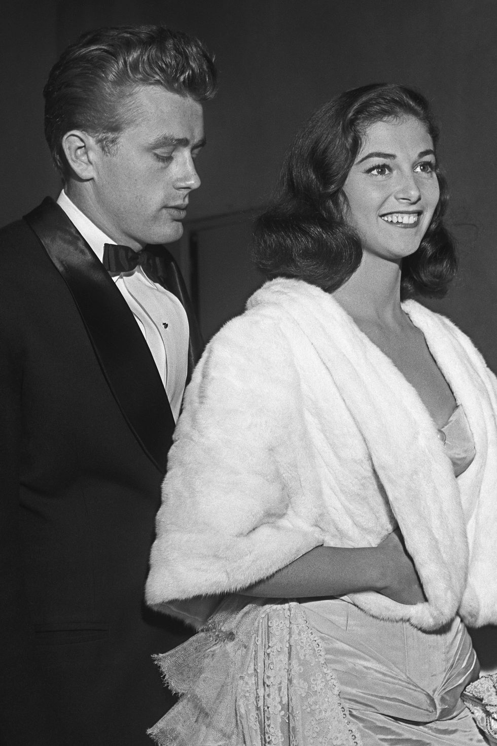 LOS ANGELES - AUGUST 10:  Movie star James Dean and Italian born actress Pier Angeli attend the premiere of the re-release of Gone With The Wind on August 10 1954 in Los Angeles, California. The Oscars won for the movie are in the background. (Photo by Michael Ochs Archive/Getty Images)