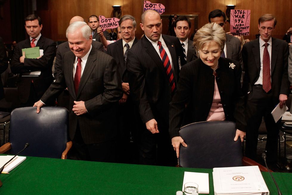 WASHINGTON - APRIL 30:  Secretary of State Hillary Clinton (R) and Secretary of Defense Robert Gates arrive at the witness table before a Senate Appropriations Committee hearing on Capitol Hill on April 30, 2009 in Washington, DC. The committee is hearing testimony from Secretary Clinton and Secretary Gates on proposed 2009 war supplemental appropriations.  (Photo by Mark Wilson/Getty Images) *** Local Caption *** Robert Gates;Hillary Clinton
