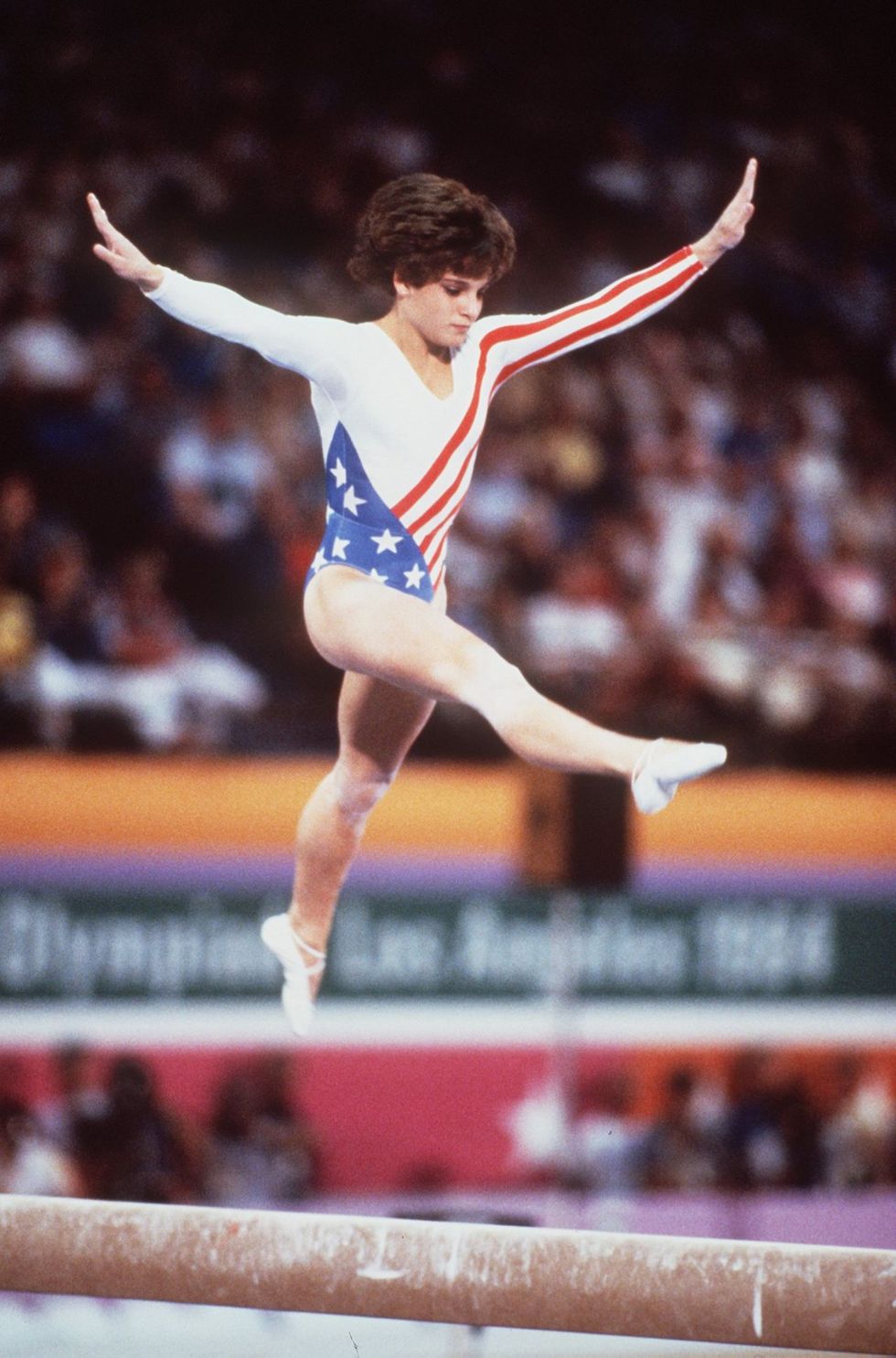 <p>In one of the most nerve-wracking vaults in Olympic history, Mary Lou Retton needed a perfect 10 in the final round in order to secure the gold—and that's exactly what she got. As for her look, Retton and a few of the other team members rocked iconic '80s short haircuts. As for the rest of the girls, the ponytail (with side-swept bangs) was still holding strong.</p>