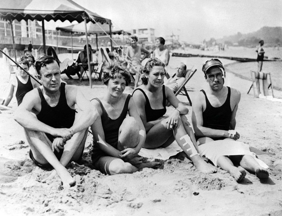 <p>Amelia Earhart with her husband, George P. Putnam and British aviators Jim and Amy Mollison on the beach at Atlantic City, New Jersey.<br></p><p>Other celebrity visitors this year: boxers Max Baer and Jack Dempsey.</p>