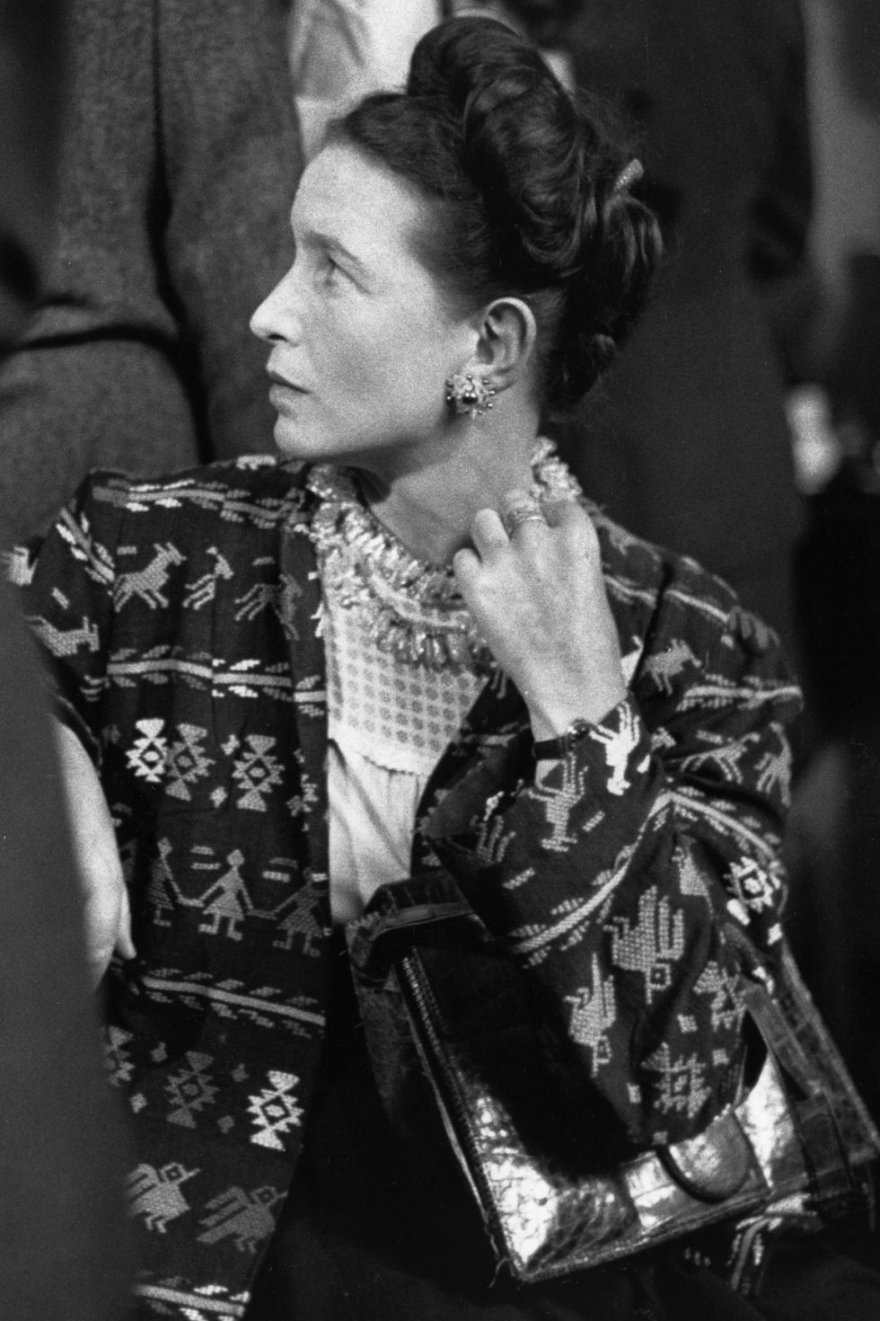 <p>Author, existentialist and feminist, Simone de Beauvoir wrote novels, biographies and essays. Most well-known for <em>The Second Sex</em>, a social analysis of women's oppression, de Beauvoir's look contained a little bit of the unfiltered insouciance seen in the French fashion scene: jackets that were a bit too big, tattered purses and dresses verging on frumpy were paired with costume jewelry that resulted in an ironic form of ugly-chic in the best possible way.</p>